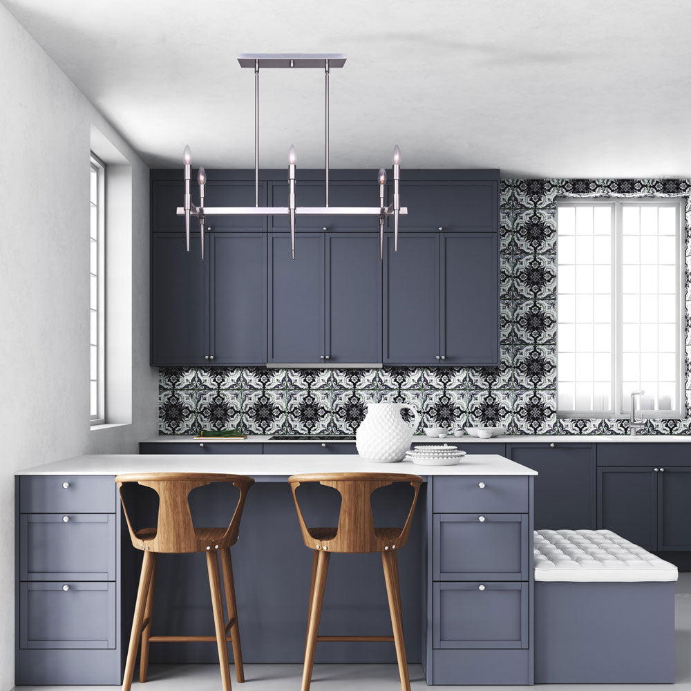 photo of a kitchen with blue cabinets and blue island, 2 wooden stools, and a 6 light in a brushed nickel finish with 6 tapered tear drop glass bulbs handing from the ceiling.