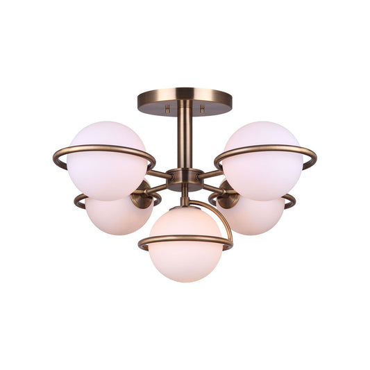 photo on an angle of a semi flush, five light, gold finish with five flat opal  globes in a mid century style